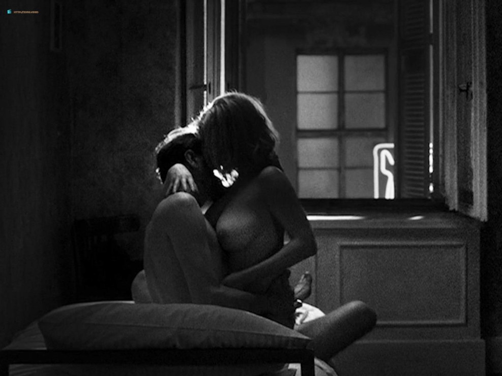 The wife is cheating while the husband is sleeping