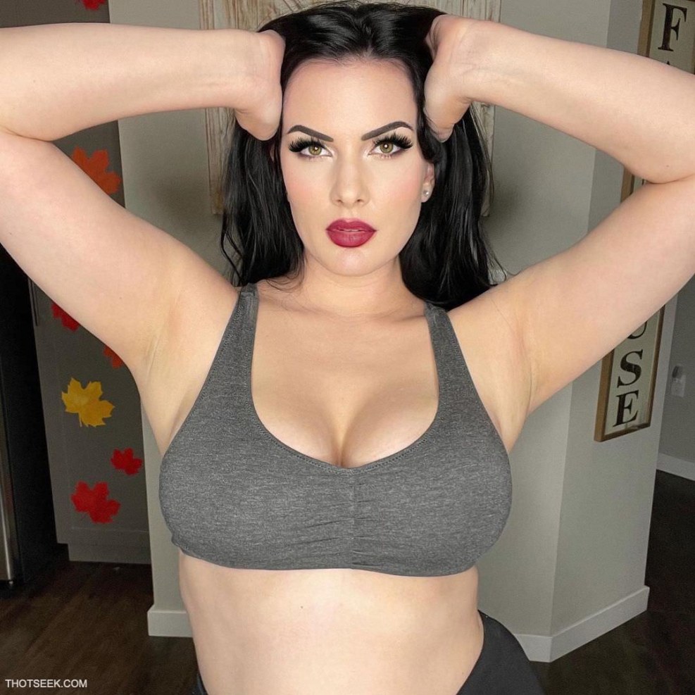 Tattooed naked women with extended legs