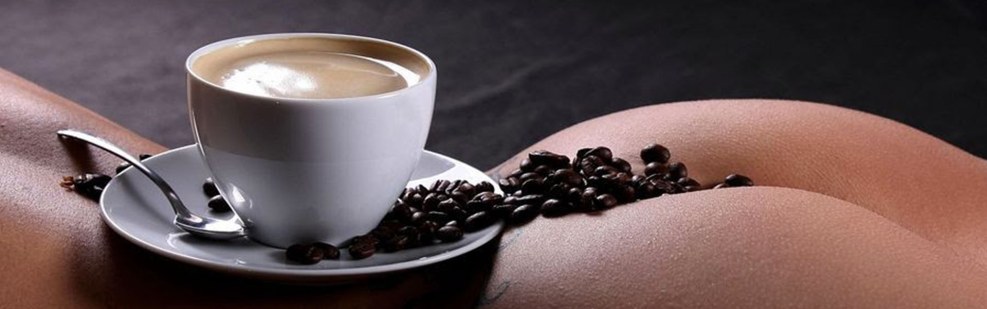 Cup of coffee on the female body