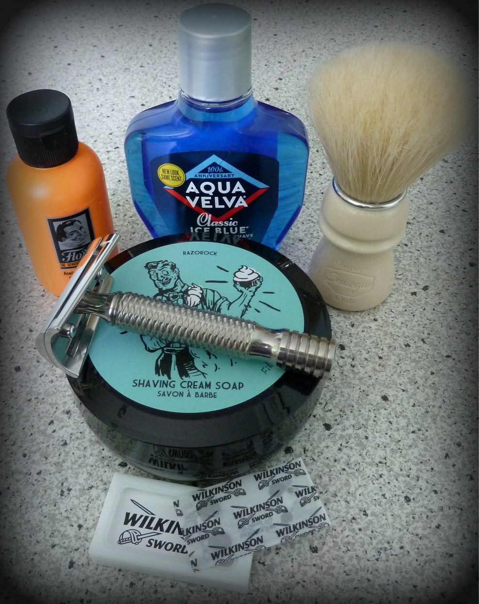 The man shaves his face