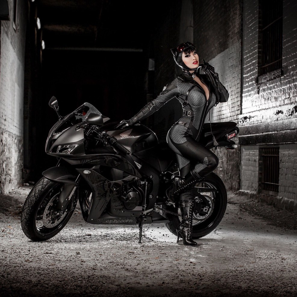 Girl on a motorcycle in a suit