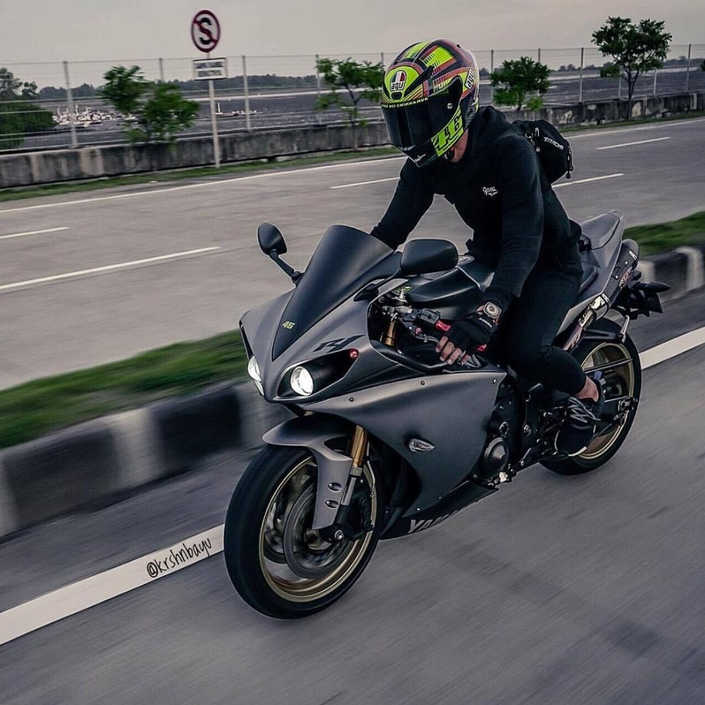 Motorcyclist with a girl