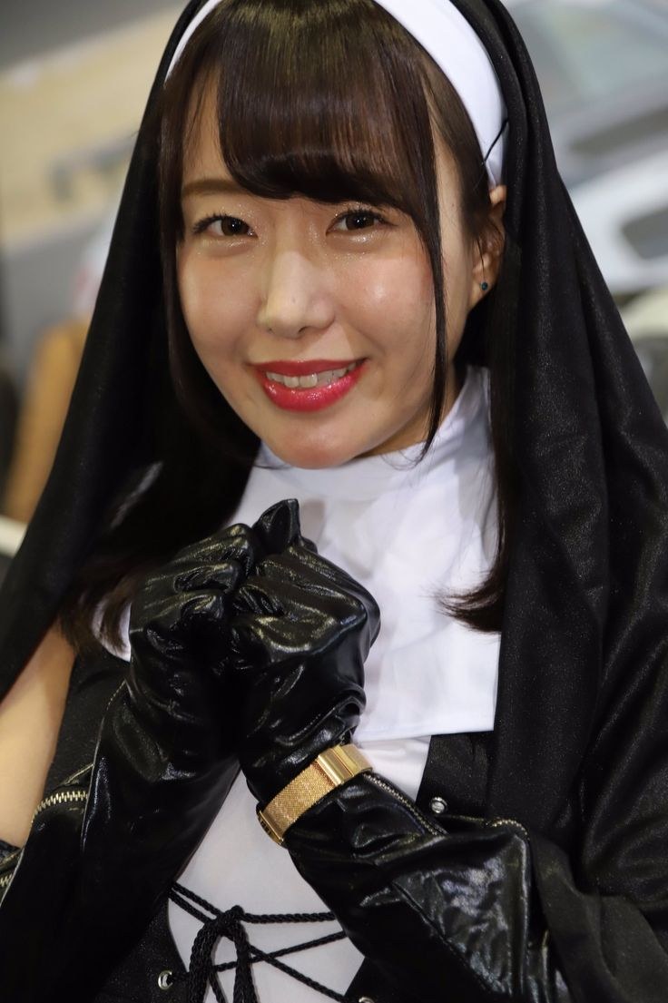 Girl in a mask and leather gloves