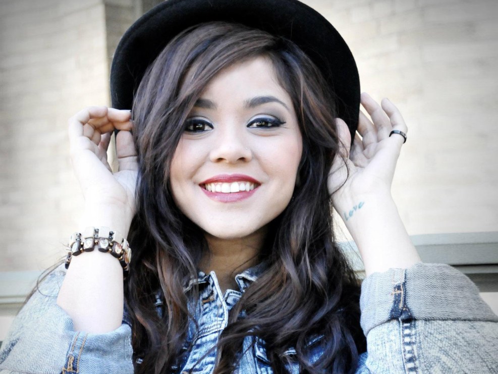 Alissa Milano on a red background