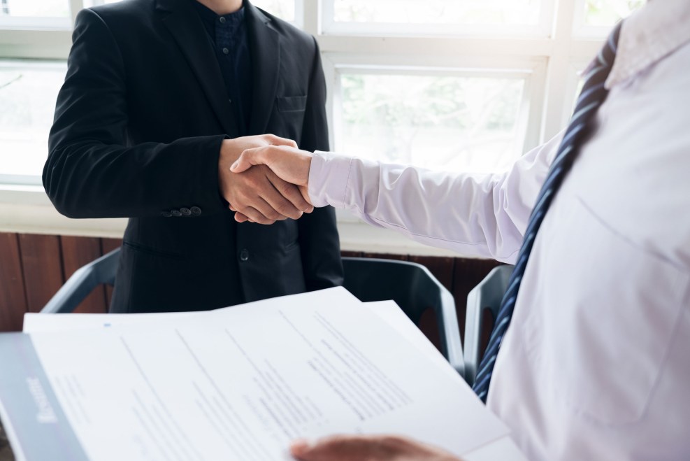 A guy with a grin at an interview