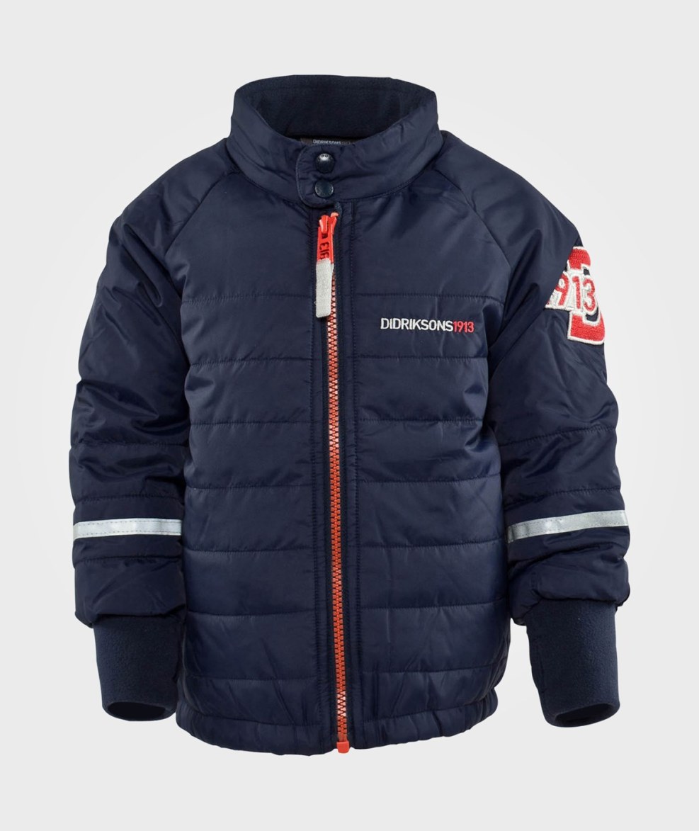 Girl in a jacket on the beach