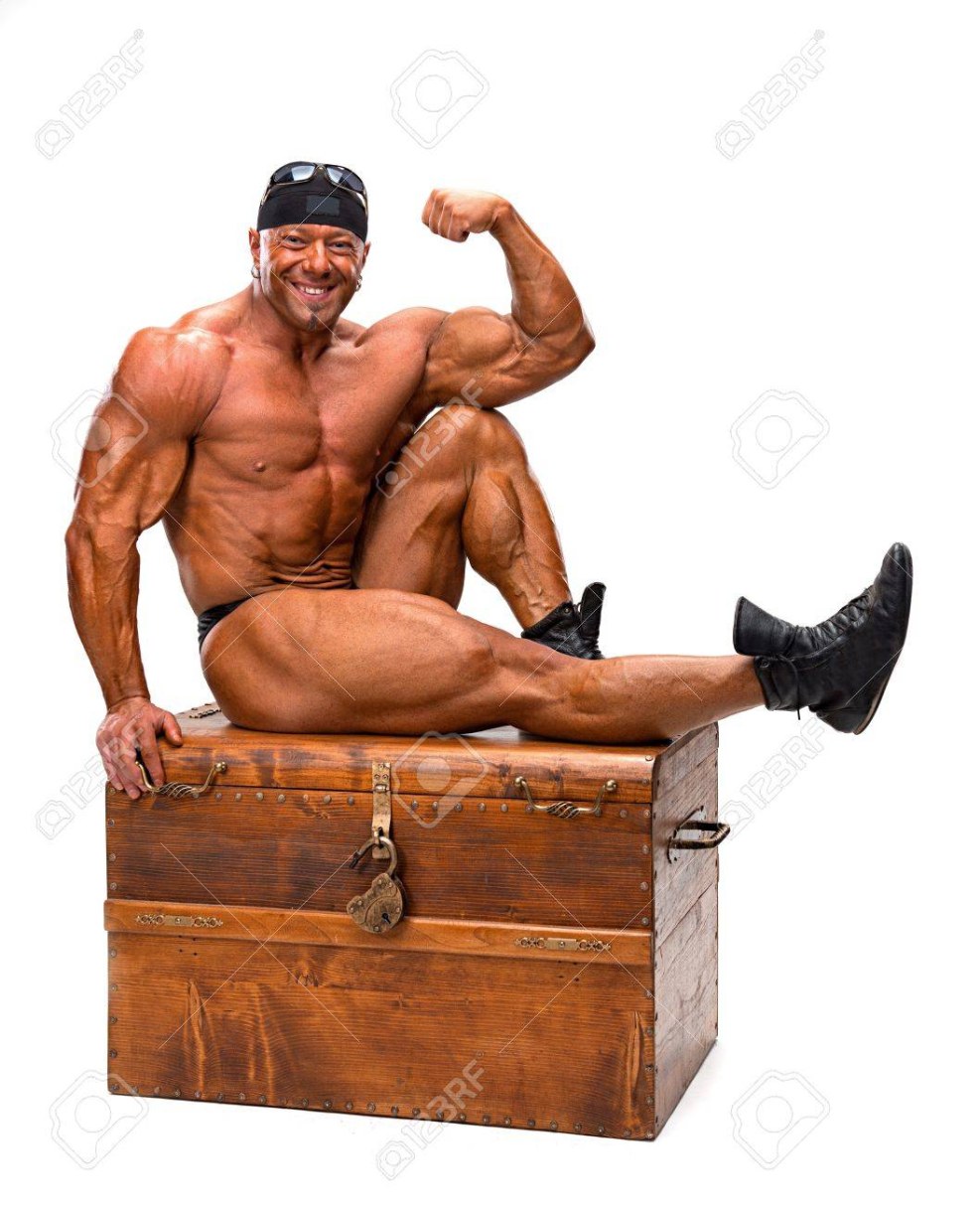 The bodybuilder is sitting