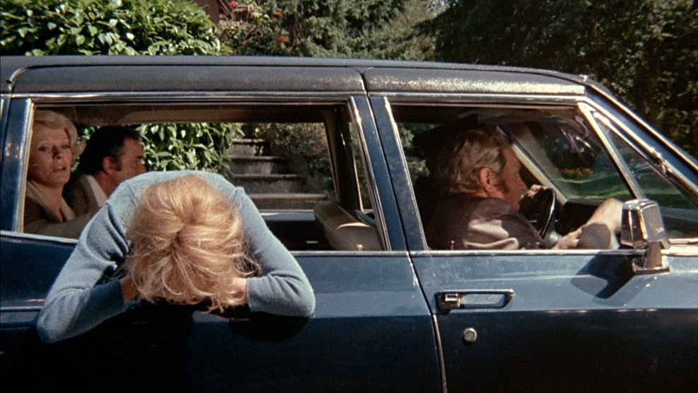 Lush white -skinned blonde in swimming trunks