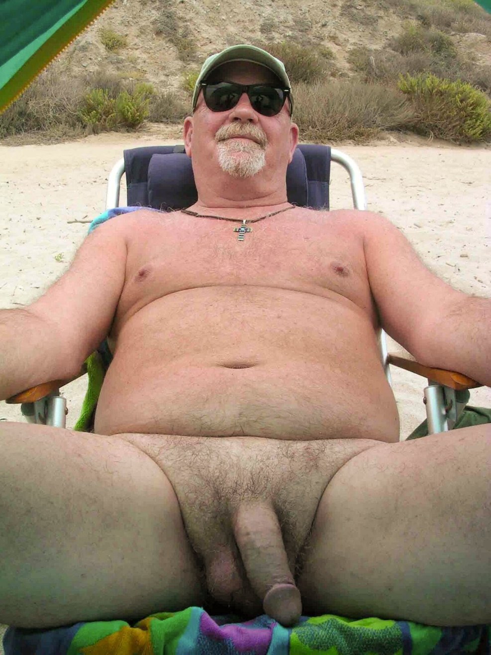 Naked fat man on the beach