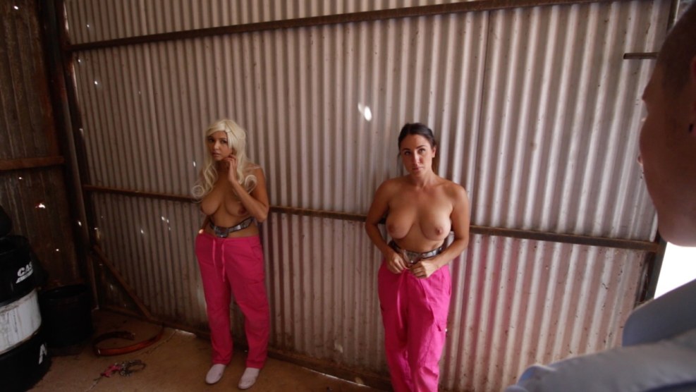 Metal Bondage Model is fastened to a metal bed