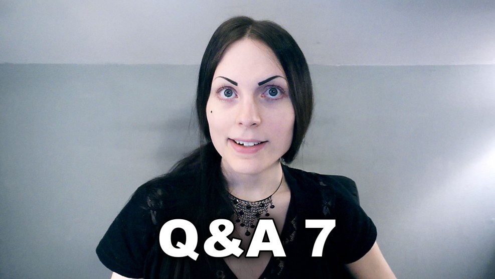 Sensual Brunette Woman Posing in Studio Wearing Jeans