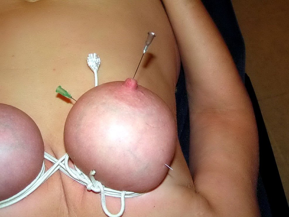 Piercing the nipples of BDSM