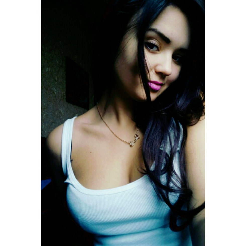 Girl sits by the sea