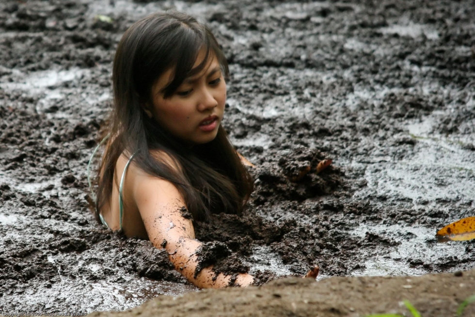 Girl Stuck Headfirst in Tar