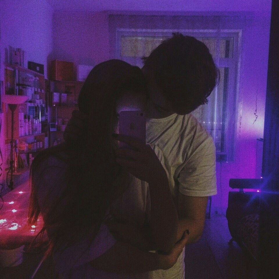 A guy with a girl at night