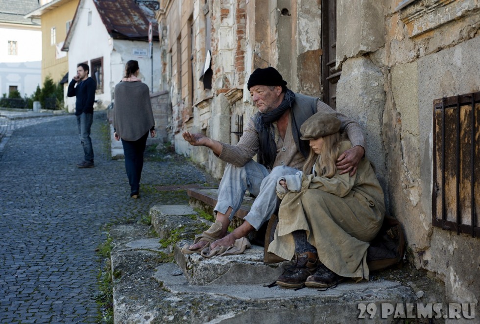 Homeless sits on the street