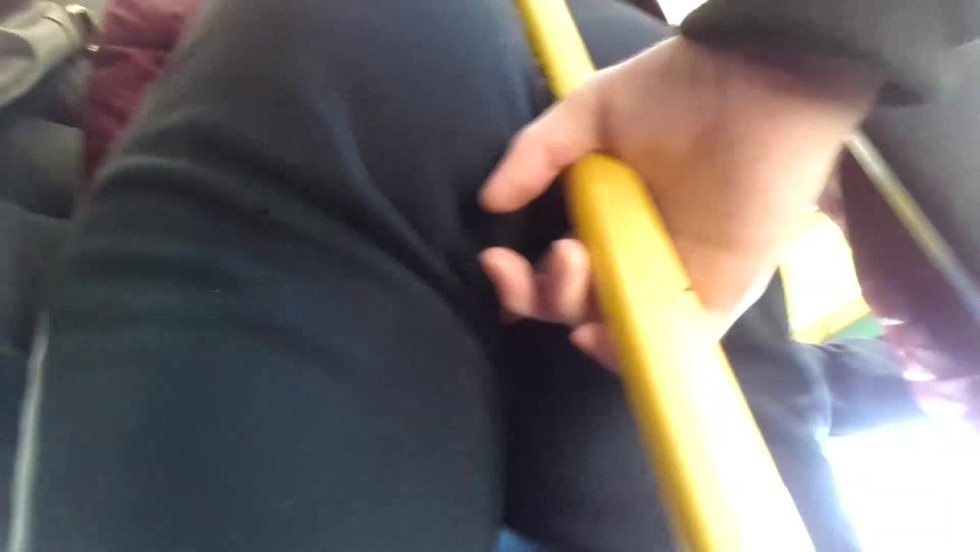 Drokha at a bus stop in front of a Muslim woman